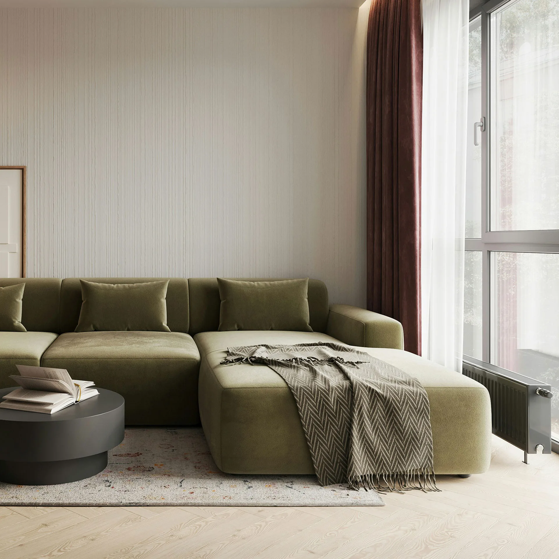 Interiörbild på inredning och soffa vid ett fönster